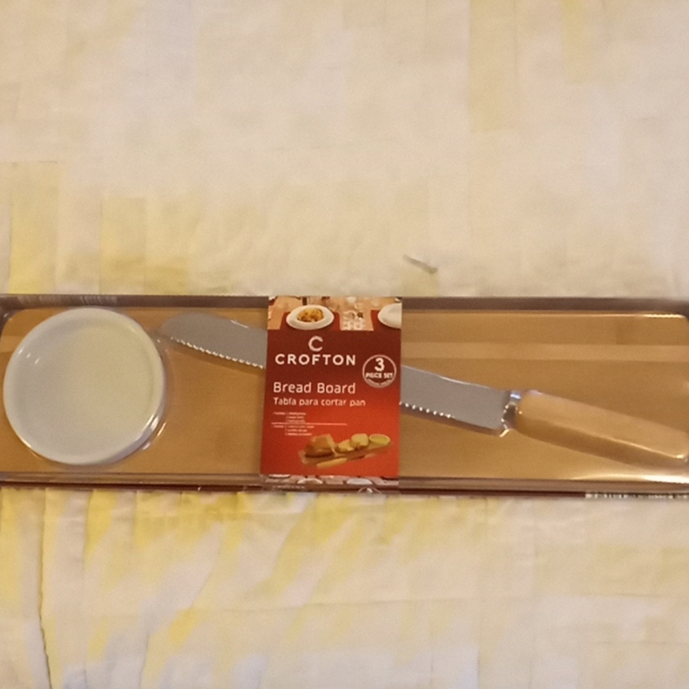 Bread board with dipping bowl and knife